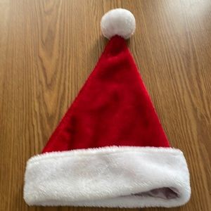Red and white Christmas hat. 🧑‍🎄 16” tall x 12” wide at opening.